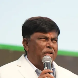 The director of Sree Raaga Resorts speaking at a resort event