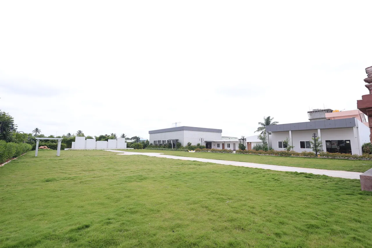 The open landscaped event lawn at Sree Raaga Resorts on a clear day