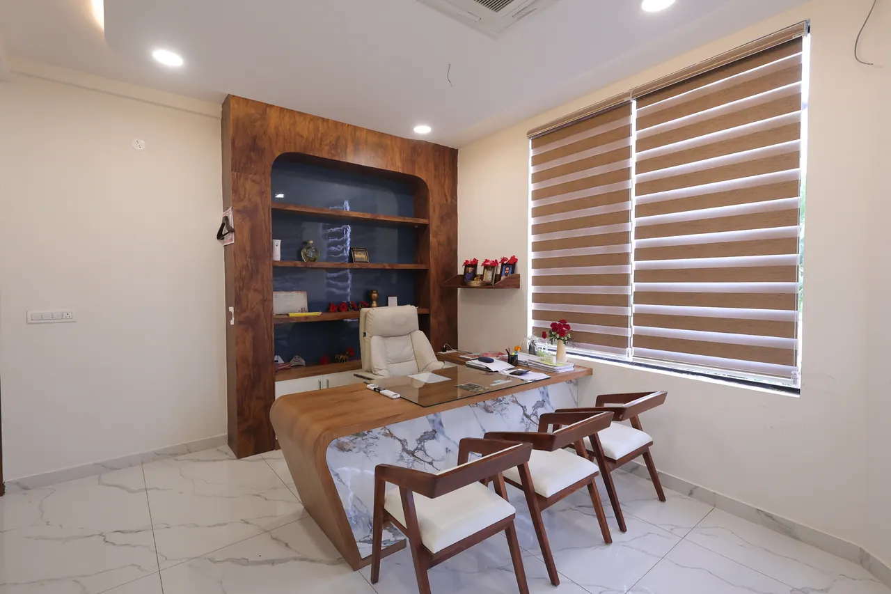 The conference room at Sree Raaga Resorts with a long marble meeting table and seating around it