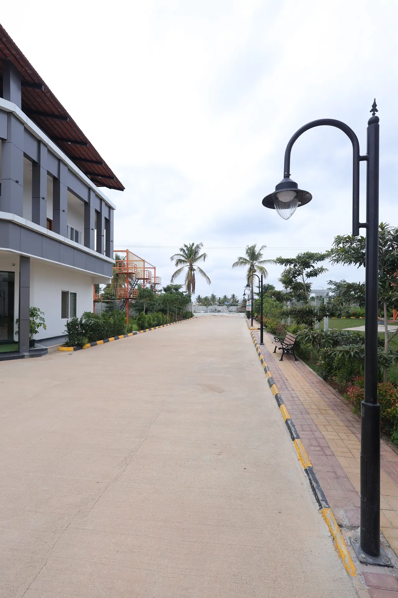 The landscaped driveway leading into Sree Raaga Resorts
