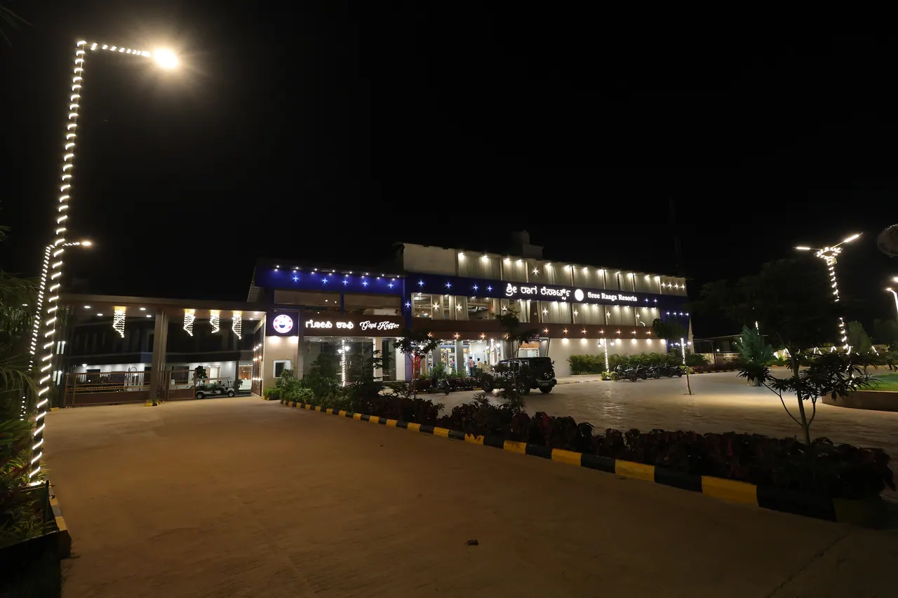 The illuminated frontage of Sree Raaga Resorts at night