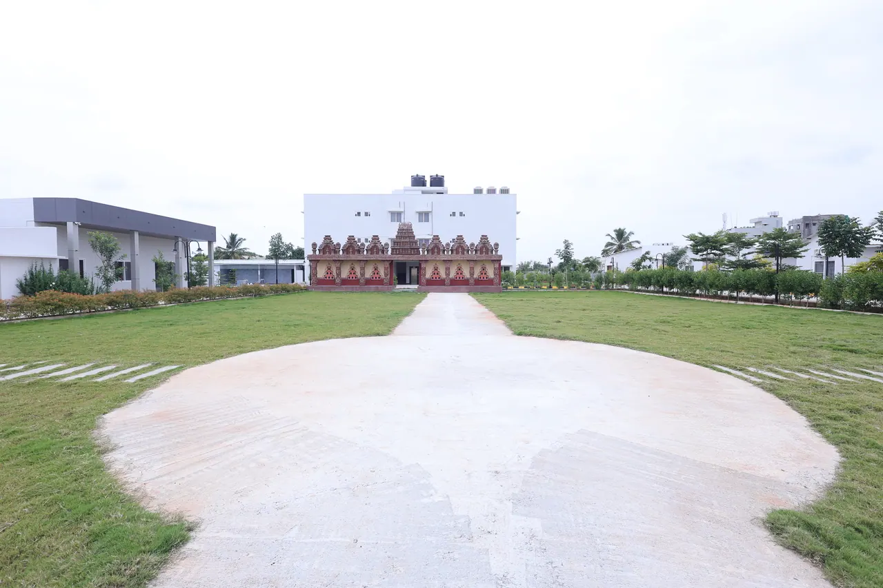 The lawn approach to the temple at Sree Raaga Resorts