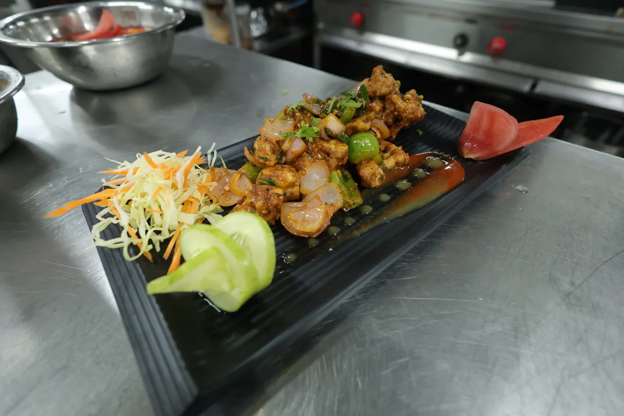 A plated chilli prawn starter from the resort kitchen