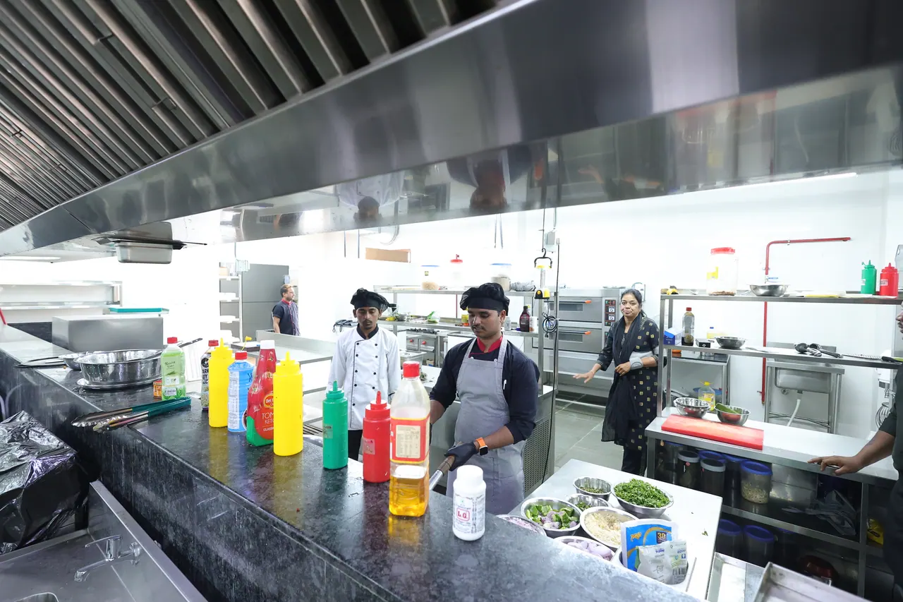 The kitchen brigade working at the prep stations