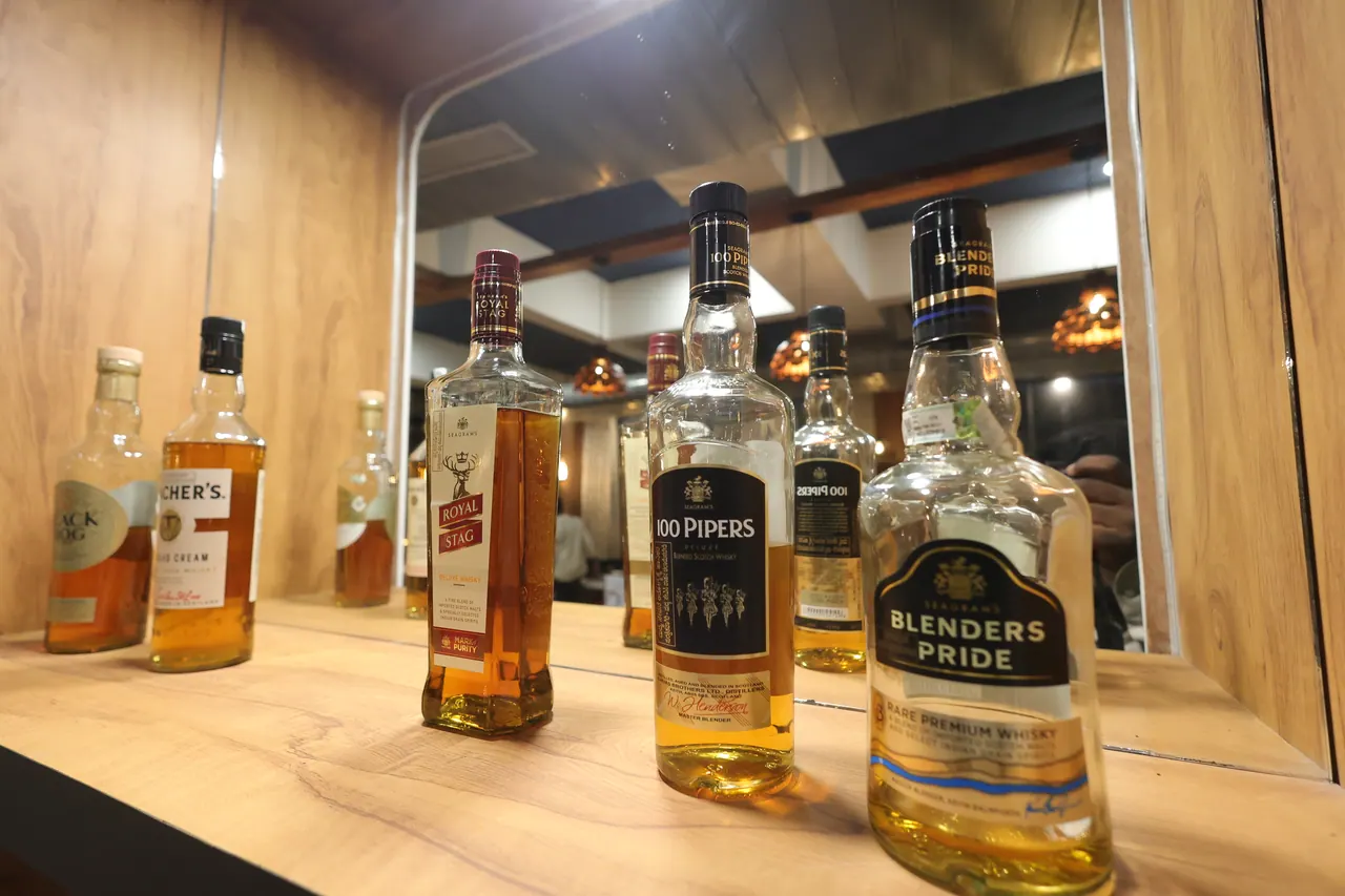 A selection of premium whisky bottles on the bar top