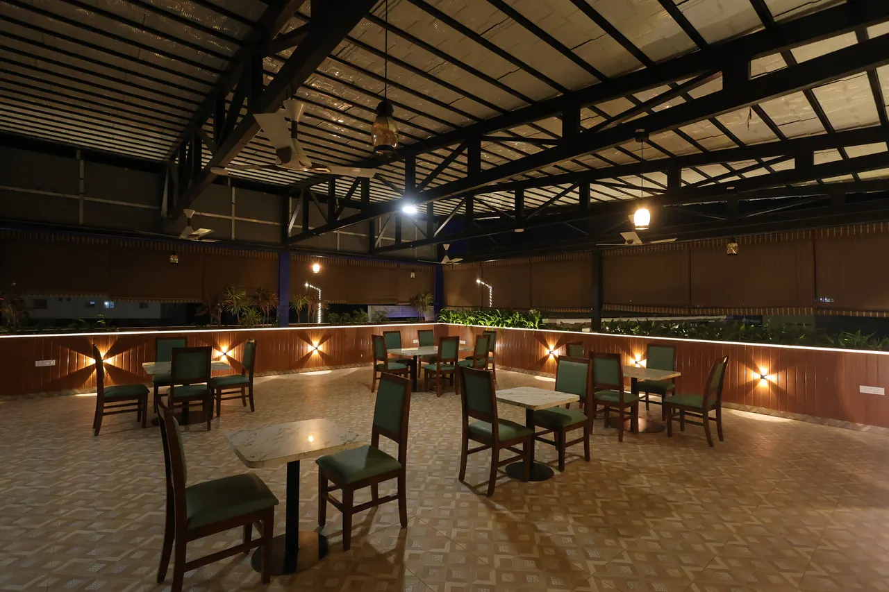 Rooftop terrace lounge seating lit for evening service