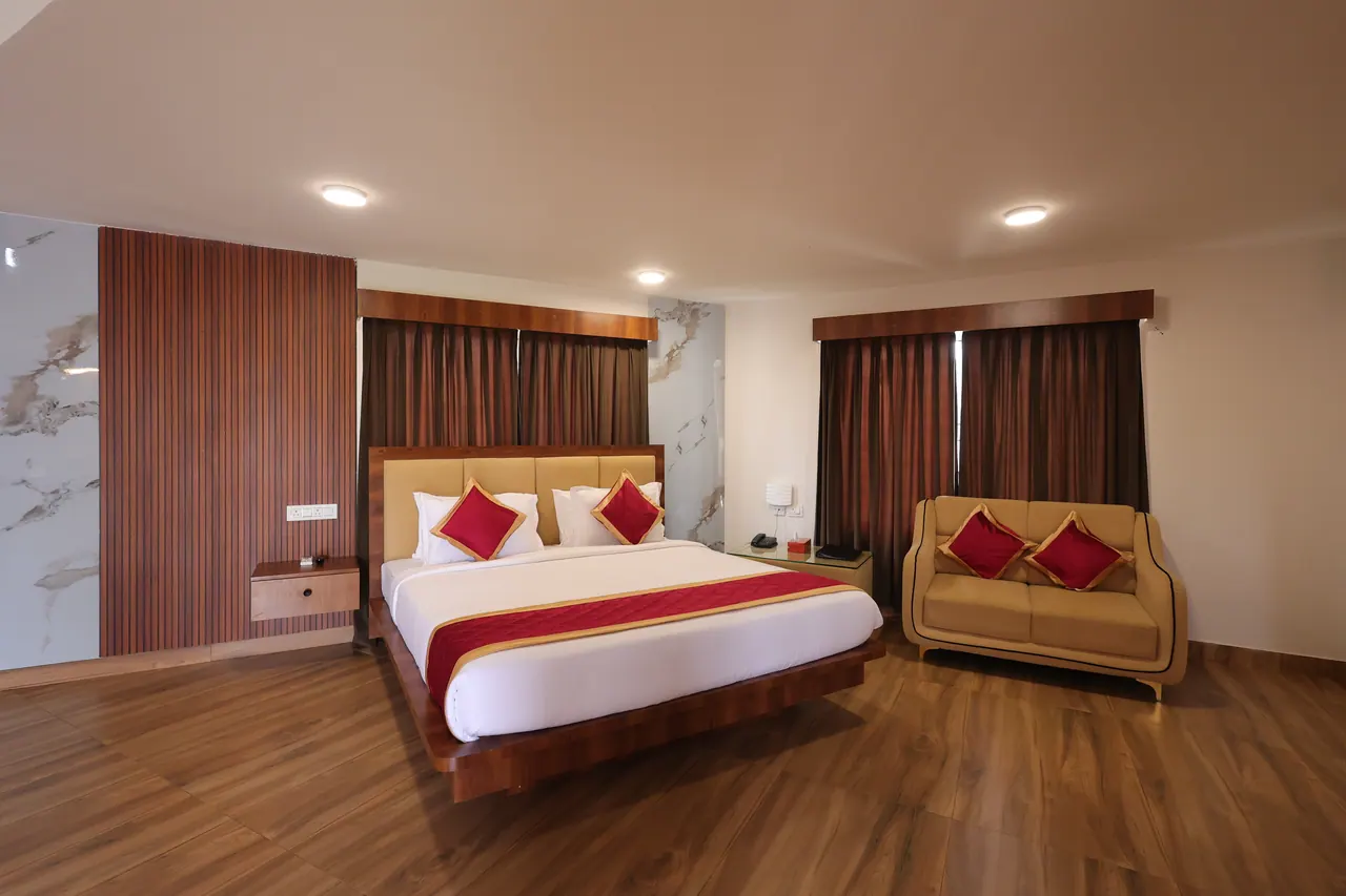 King bed on the lower level of the duplex with fluted teak panelling behind it