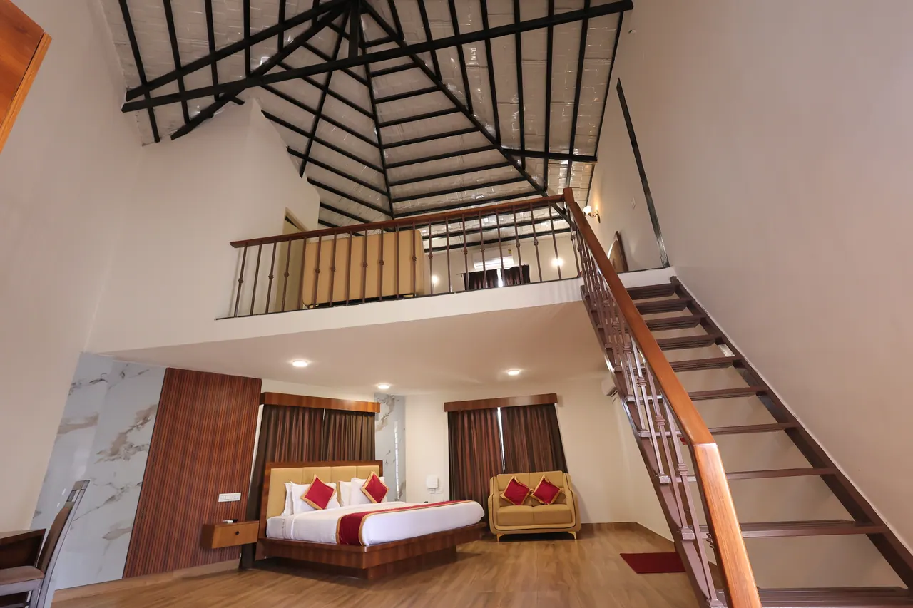 Looking down the duplex mezzanine staircase into the double-height living space