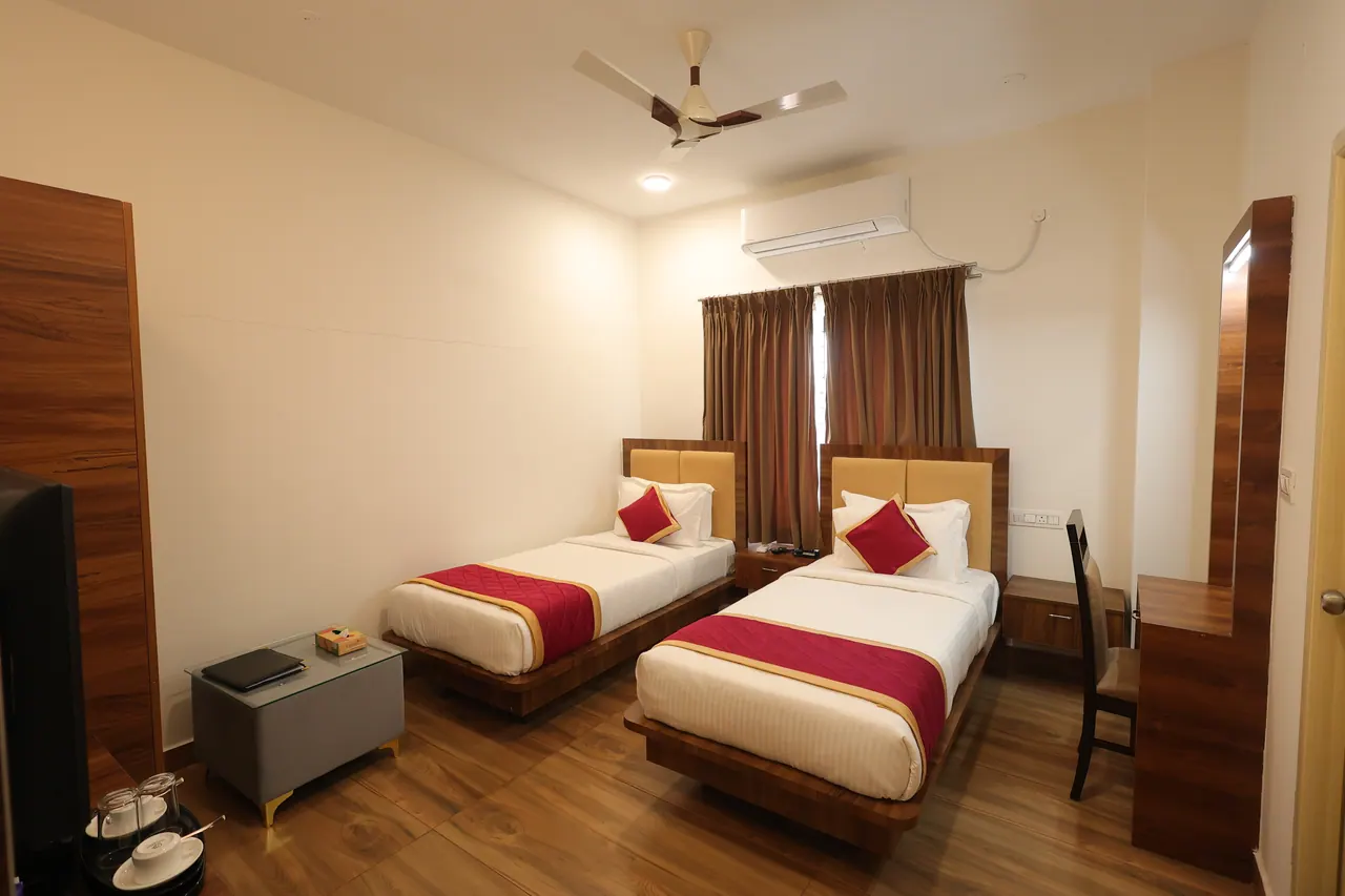 An executive room at Sree Raaga Resorts with twin beds