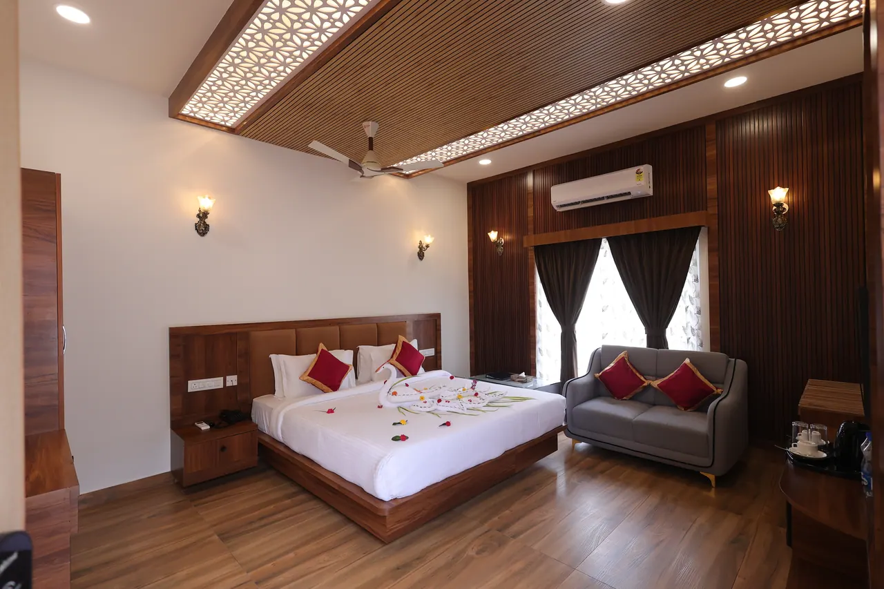 A luxury villa bedroom with a backlit jaali ceiling