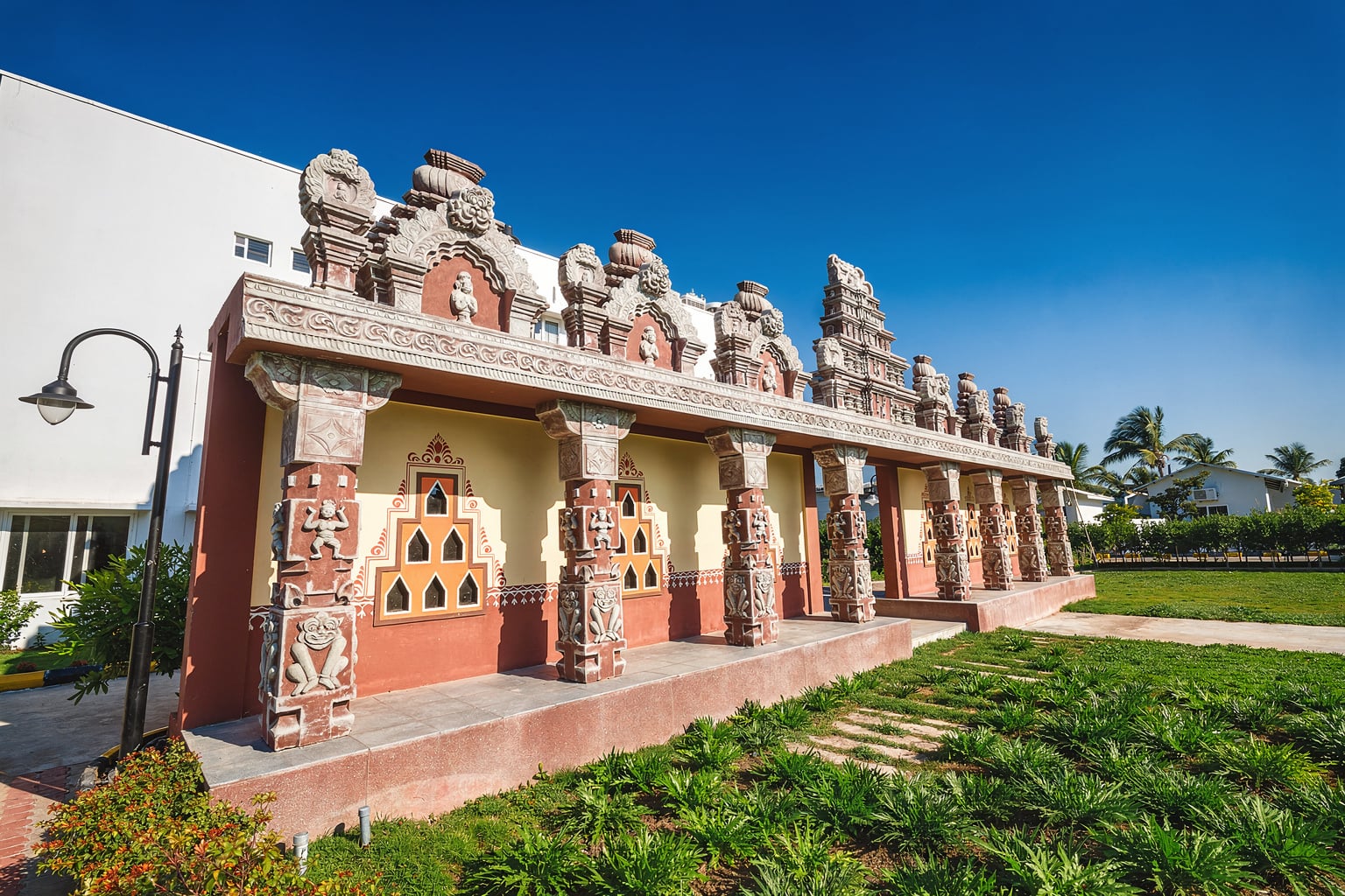 The Hoysala-style carved corridor at Sree Raaga Resorts